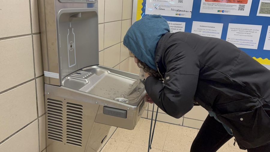 Eliana Ferreira drinks from the 3rd floor water fountain--one of the safest sources of water in the building.