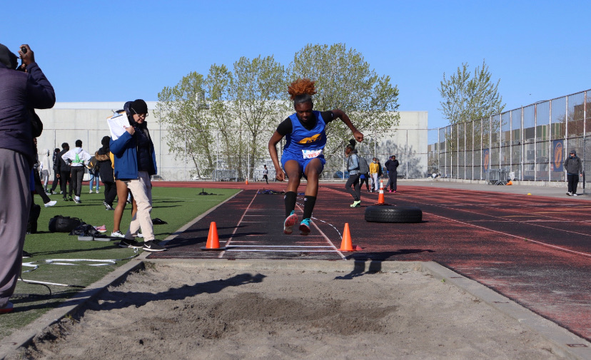 Freshman+runner+Zaqiyah+Bacchas++competes+in+the+long+jump+at+Thomas+Jefferson+High+School+field.