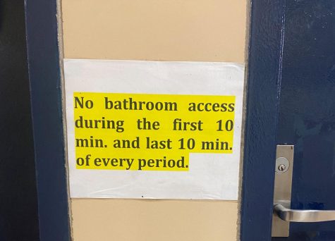 A poster outside the second floor bathrooms to remind students of the current bathroom policy.