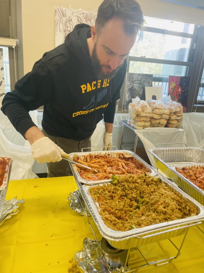 Mr. Worthington serves fried rice and ziti in Mr. Zoboi’s room.
