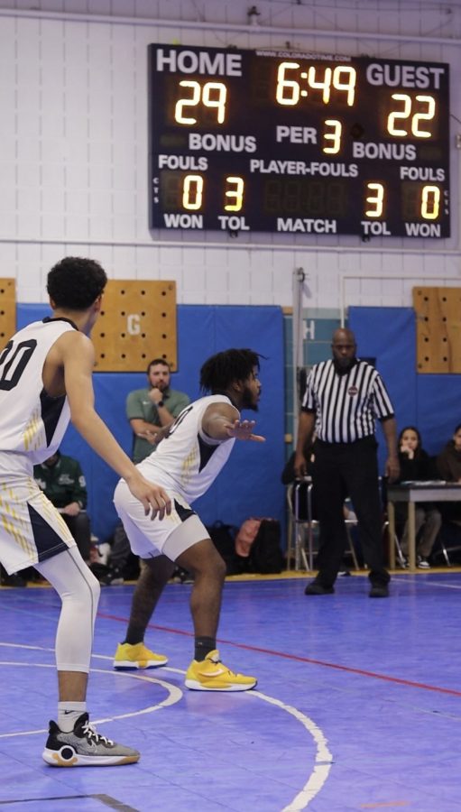 Co-captains Marcus Shields and Jared Vargas defend their basket against Lab Museum United.