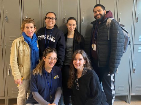 Clockwise from left: Ms. Meghan, Ms. Medina, Ms. Zoupidis, Mr. Suriel, Ms. Mornhinweg and Ms. Trezza pose together in the third-floor hallway.