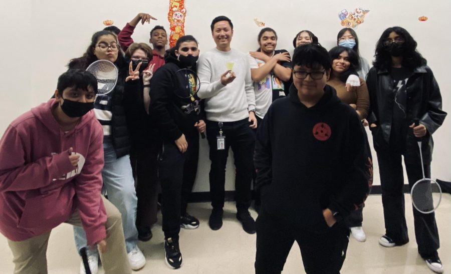 Mr. Lin, middle, with his badminton club.