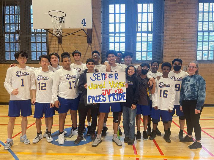 A group photo of the Pace boys volleyball team, commemorating Jared Vargas JV as Paces Pride.