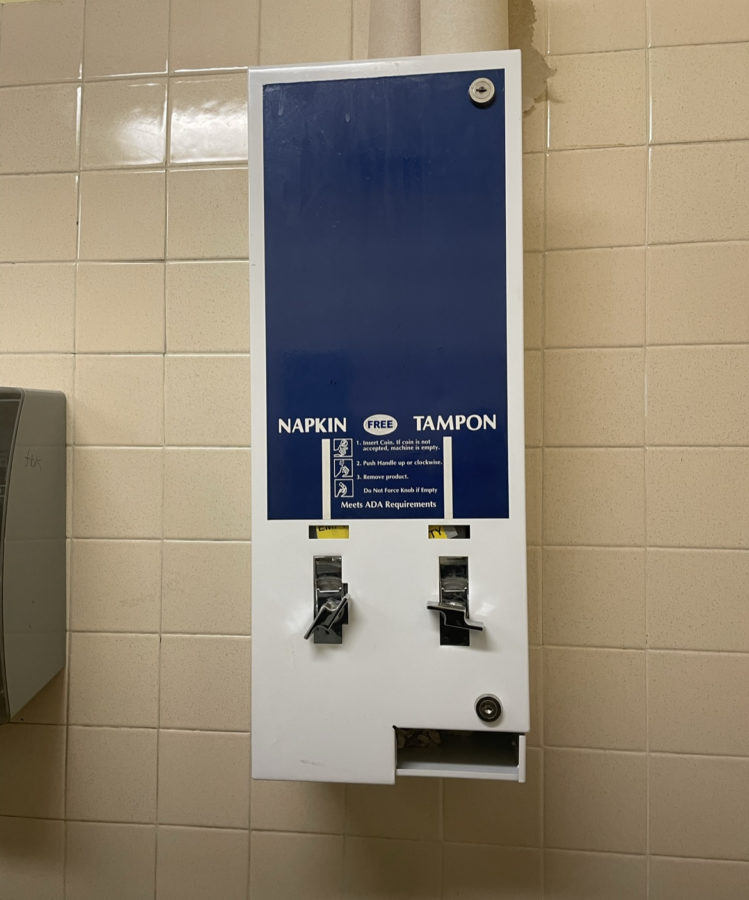 Each bathroom with empty feminine products.