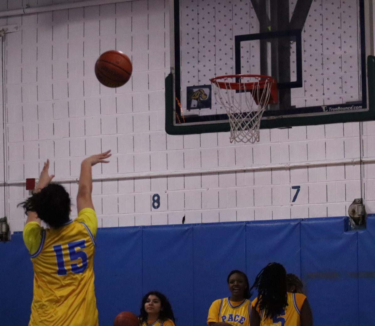 Megan Correa (15), a sophomore player on the team, attempts a jump shot during practice.