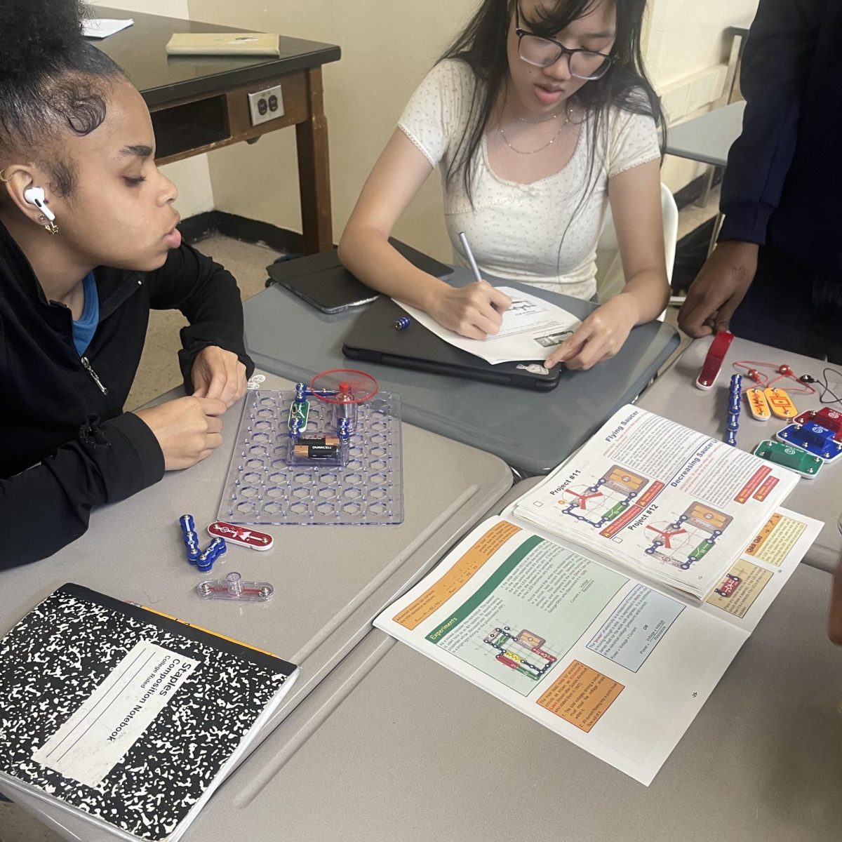 Lee Lee Henry and Ke Ying Chan work on a circuit lab in physics class. (photo: Mr. Suriel).