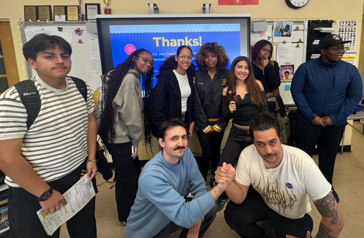 The debate team and their coach Joey D. Colandrea