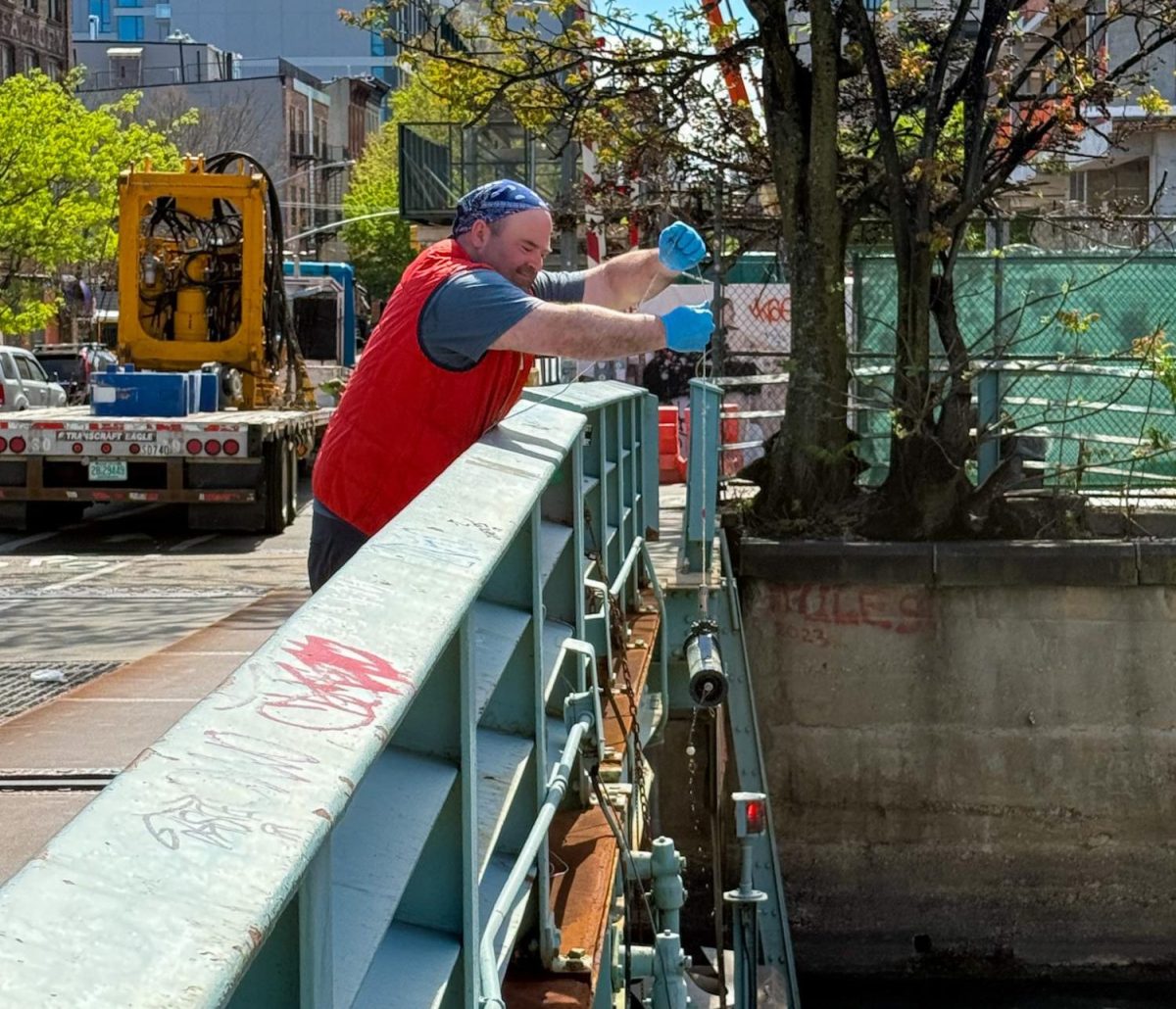 Mr. Paris takes water samples at Gowanus Canal (provided by Mr. Paris)