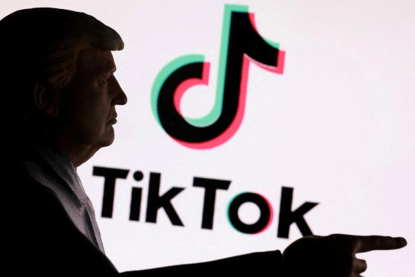 3D-printed miniature model depicting U.S. President Donald Trump in front of TikTok logo is shown in this illustration taken September 24, 2025. REUTERS/Dado Ruvic/Illustration