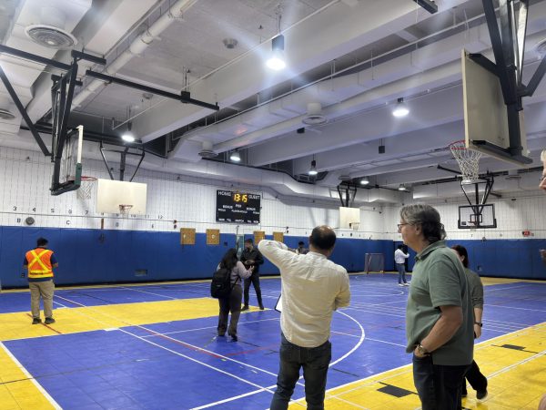 Contractors from the School Construction Authority viewed the gym to determine if they will take on the project.