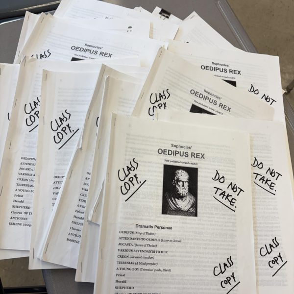 A stack of Oedipus Rex printed paper packets for a Ninth grade English class.